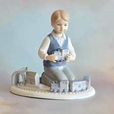 Leonardo Collection Boy ‘First Trainset’ figurine by Annie Rowe Boxed Excellent