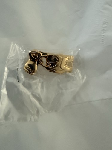Taser gold coloured pin - taser,