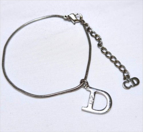 Christian dior logo charm - d,