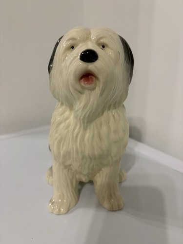 Old english sheep dog sitting - english,