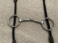 Cheltenham gag bit with black rope cheek pieces