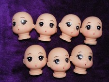 7 small cute vinyl doll heads