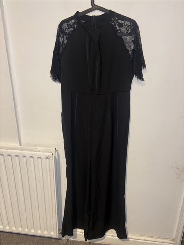 Black jumpsuit featuring