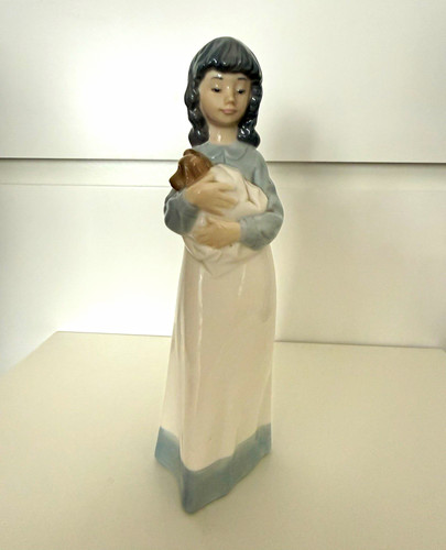 Nao porcelain girl holding - nao,