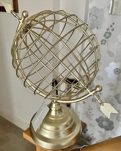 New gold rotating globe with - rotating,