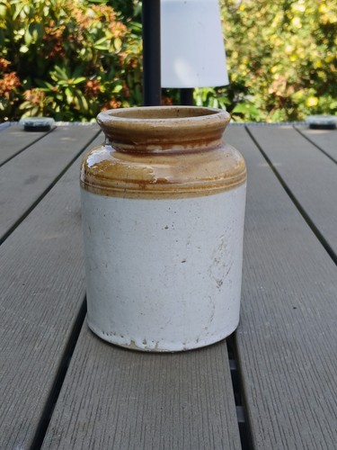 Old stoneware jar with honey - old,