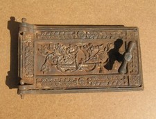 Antique cast iron door with frame for wood burning stove