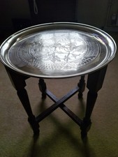 Vintage foldable 4 solid wood legs with brass table top 15" diameter.  Used