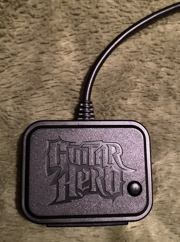 Guitar hero red - •,