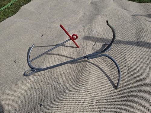 Two small metal boat anchors - small,