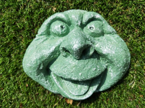 Cheeky laughing stone face - cheeky,