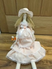 handmade tilda doll holding a