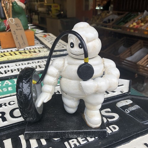 Michelin man inflating tyre - inflating,