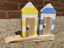 Pair of cute wooden beach huts