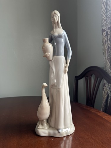 Woman holding vase - with, duck,"