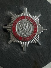 OBSOLETE NOTH EASTERN FIRE BRIGADE CAP BADGE. SCOTLAND 