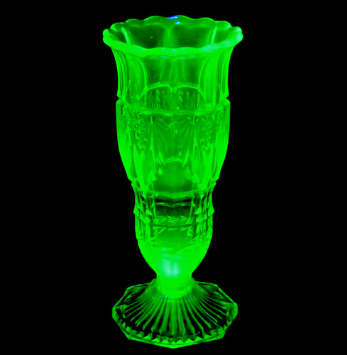 Uranium glass vase glows under - glass,