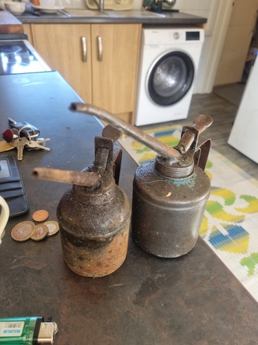 Vintage oil cans ends - cans,