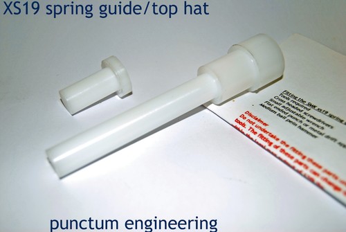 Spring guide and top - hat, to