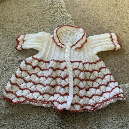 Hand knitted baby - hand,