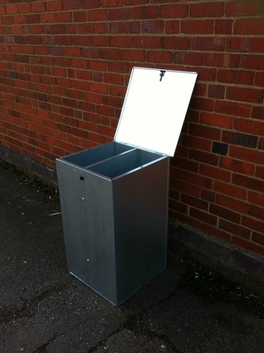 Small galvanised feed bin with - feed,