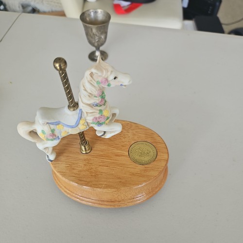 Musical carousel horse goes - ,