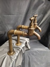 TALL BRASS BIB TAPS, AGED