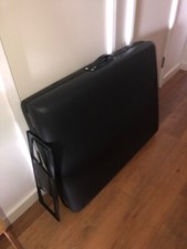black foldable massage couch
