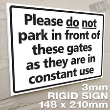 PLEASE DO NOT PARK IN FRONT OF THESE GATES AS THEY ARE IN CONSTANT USE SIGN