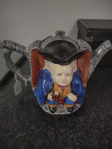 Double faced toby teapot hand - double,