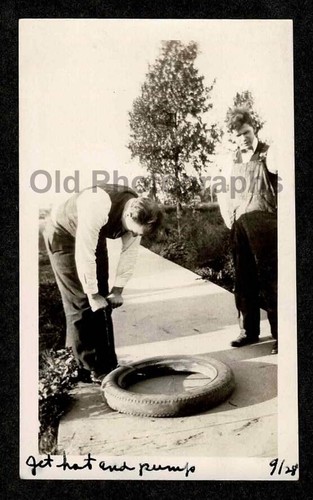1928 car tire repair men - car,