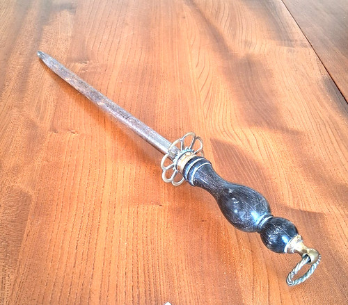 Antique fire poker with - , wooden