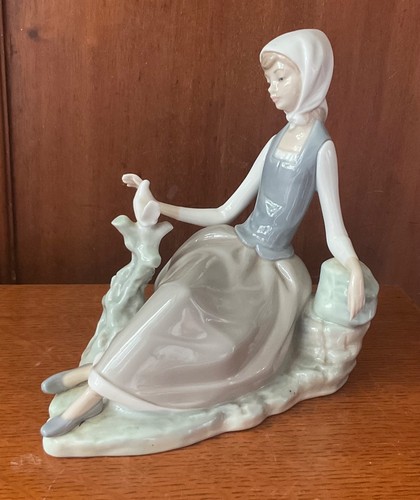 Lladro seated girl with - seated, dove
