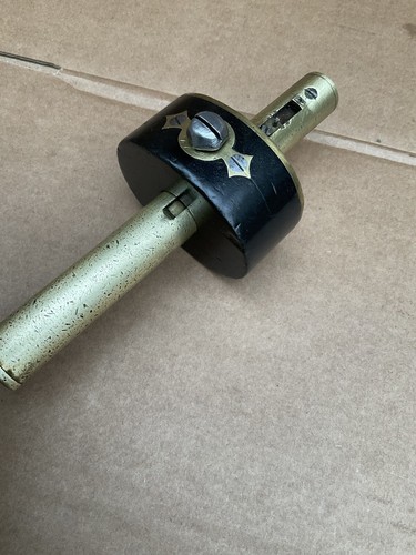 Brass and ebony - and, mortice