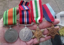 A GENUINE WW2 FOUR MEDAL GROUP, WAR & DEFENCE, 1939-45 & ITALY STARS.
