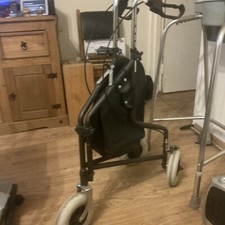 A three wheeled disabled walker with brakes