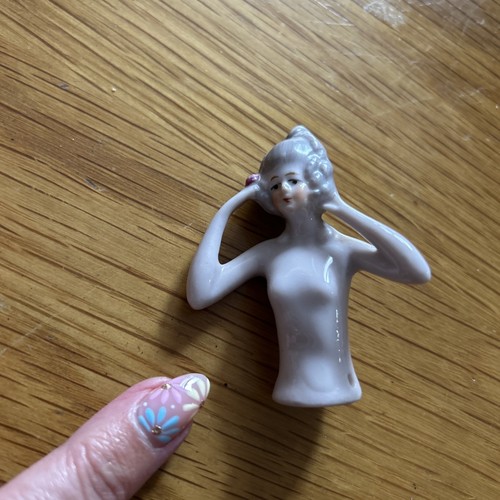 Antique porcelain half doll - half,