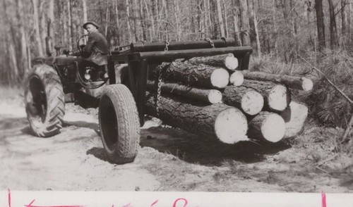 1950s man tractor log - tractor, hauler