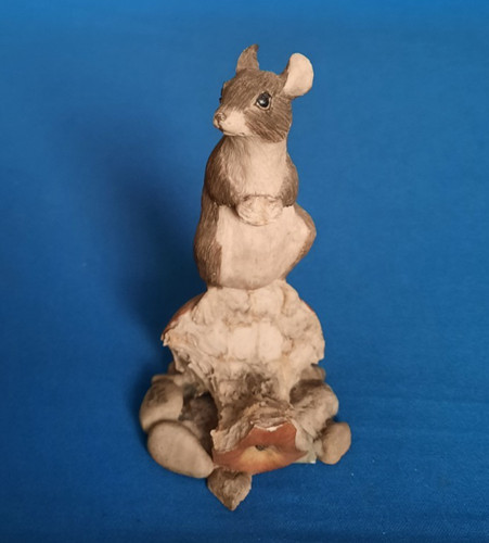 Figurine mouse feeding on - feeding,