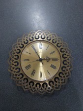 A Vintage Coral German Wall Clock With Sunburst Design
