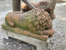 PAIR TERRACOTTA RECUMBENT LIONS IN THE STYLE OF CANOVA