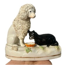 STAFFORDSHIRE UNRECORDED RARE GROUP OF A POODLE & BLACK CAT BY BOWL C1830