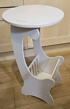 White wooden table with magazine rack