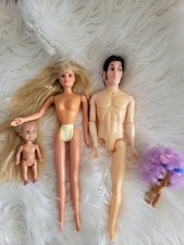 Broken Barbie Dolls And Others