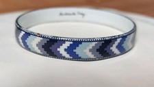 Michaela Frey enamel bangle with a purple and grey geometric pattern.