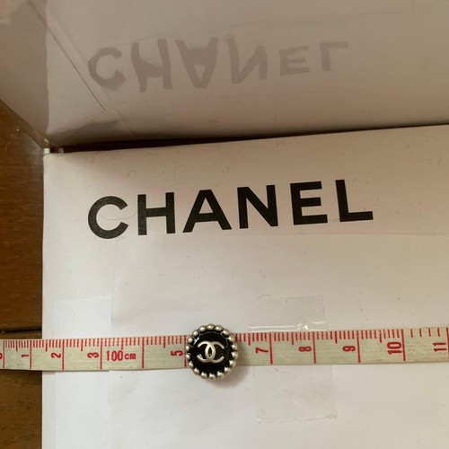 Chanel black pearl trim here - trim-,