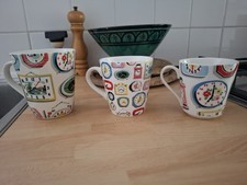 3 Fab clock Mugs By CATH KIDSON