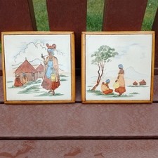 pilkington tiles , pair of, mounted, depicting tribal village scenes