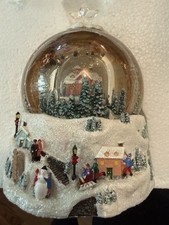 Thomas Kinkade Christmas snow globe, featuring a Victorian-style village scene