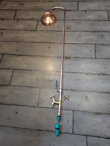 Outdoor sauna shower with tap